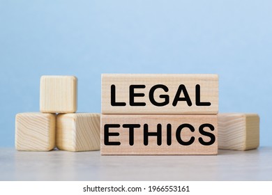 LEGAL ETHICS. WOODEN BARS With Information On The Desktop.