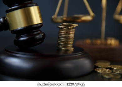 legal gavel and coins in a coin jar