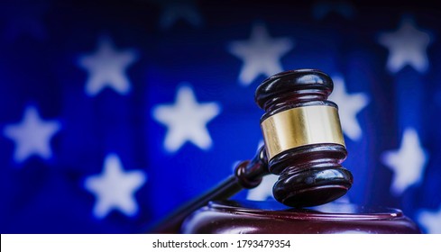 Legal law concept image, gavel with US flag background.