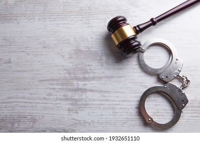 Legal law concept image - gavel and handcuffs