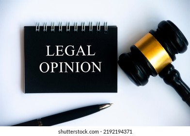 Legal Opinion Text On Black Notepad With Gavel On White Background. Legal And Law Concept.