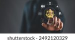 Legal Professional with Justice Icons. A suited legal professional touches virtual icons symbolizing law, justice, and legal services. business legislation, Notary public, legal advice online, Lawyer
