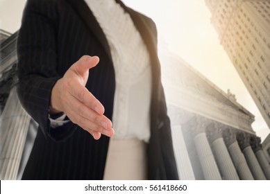legal services. Female lawyer offering handshake with client for legal adviser.