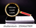 Legal services of lawyers for medical malpractice claims. PERSONAL INJURY CLAIMS words through a magnifying glass on a black background