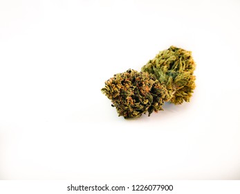 Legal Weed Flower Cannabis Ganja Plant on White Board with Green Leaves