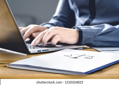 Legal Worker In Law Firm With Laptop Computer. Attorney, Prosecutor Or Solicitor Working On A Legislation Case. Lawyer Or Secretary Writing Paper Document Contract Brief. Career And Business In Court.