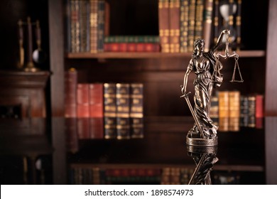 Legally Concept. Law Symbols On Bookshelf Background. 