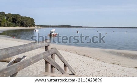 lege cap ferret wooden sea access pathway leading to sand beach atlantic ocean horizon in Arcachon bay in france