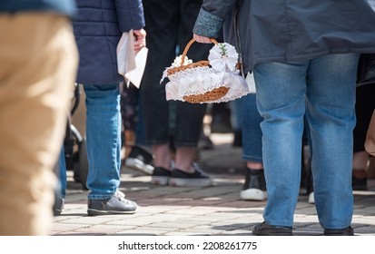 Legionowo, Poland - April 16, 2022: Blessing Food In Front Of The Church. Christian Tradition For Easter. People With Baskets In Front Of The Church.