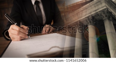legislation law legal concept. lawyer signing legal document and agreement with court background. wide view.