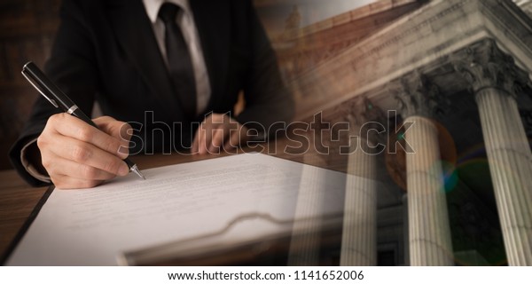 legislation law legal\
concept. lawyer signing legal document and agreement with court\
background. wide\
view.