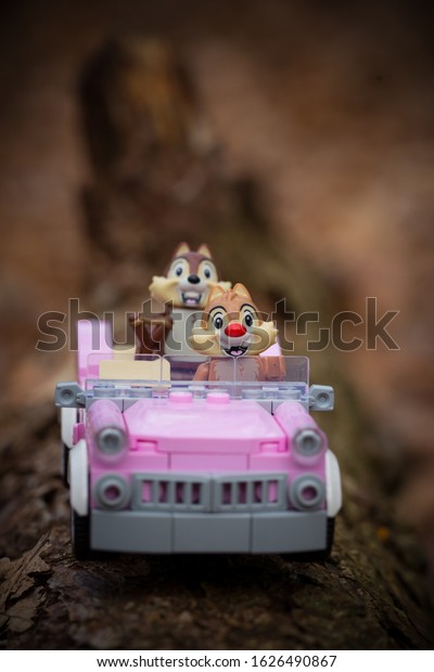 Lego\
mini figures chip and chap drive in a pink cadillac\
