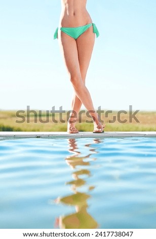 Legs, bikini and woman by swimming pool in nature outdoor for vacation, holiday or summer travel in the countryside by blue sky mockup space. Feet, water and young person in swimsuit, beauty and body