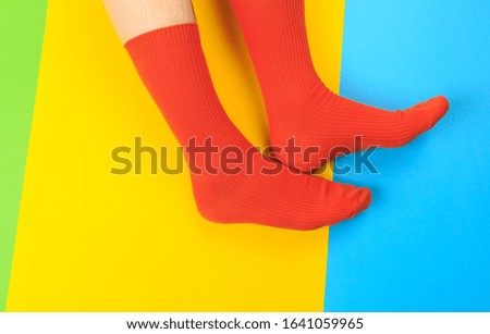 legs in colorful socks on colorful  background