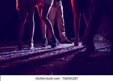 Legs of dancing people at the party.