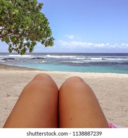 Legs With Fake Spray Tan On Sun Lounger On Tropical Beach At Lefaga, Upolu Island, Western Samoa, South Pacific