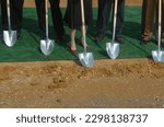 Legs, feet and shovels at a ground breaking ceremony (no faces)