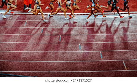 Legs of female Track and Field Athletes running on the track during professional 1500 m race. Middle distance sport photo. - Powered by Shutterstock