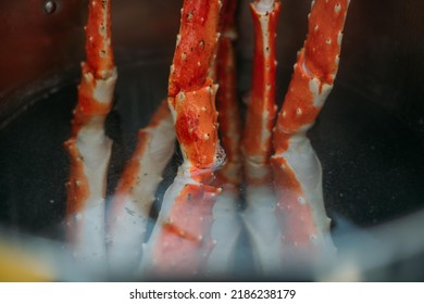 Legs Of Fresh Red Kamchatka Crab In A Pot Of Water In The Restaurant Kitchen. Preparation Of Fresh Crab Meat For A Delicious Seafood Dish