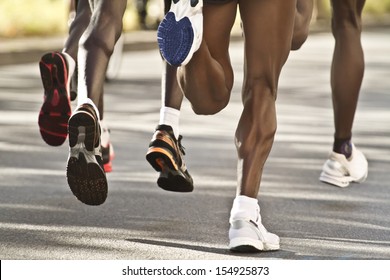 Legs Of A Group Street Marathon Runners