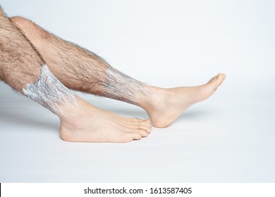 Legs Hair Removal For Men. Applies Hair Removal Cream To Part.