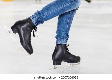 Legs Of Ice Skater With Start Sign On The Ice Rink, View From Above