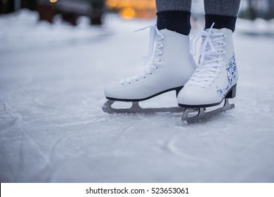 Legs Of Ice Skater With Start Sign On The Ice Rink, View From Above