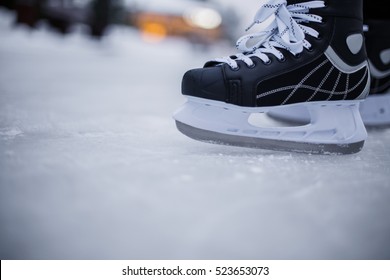 Legs Of Ice Skater With Start Sign On The Ice Rink, View From Above