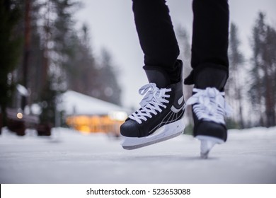 Legs Of Ice Skater With Start Sign On The Ice Rink, View From Above