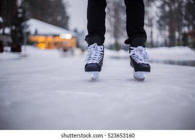 Legs Of Ice Skater With Start Sign On The Ice Rink, View From Above