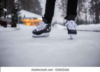 Legs Of Ice Skater With Start Sign On The Ice Rink, View From Above