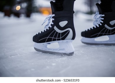 Legs Of Ice Skater With Start Sign On The Ice Rink, View From Above