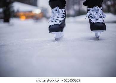 Legs Of Ice Skater With Start Sign On The Ice Rink, View From Above