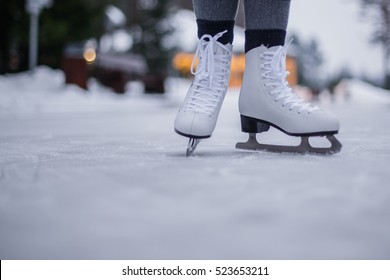 Legs Of Ice Skater With Start Sign On The Ice Rink, View From Above