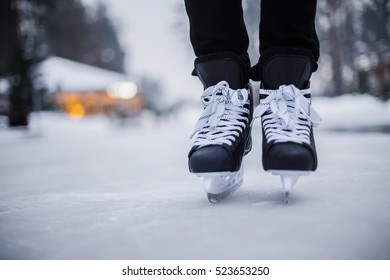 Legs Of Ice Skater With Start Sign On The Ice Rink, View From Above