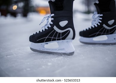 Legs Of Ice Skater With Start Sign On The Ice Rink, View From Above