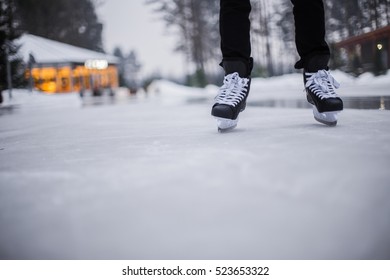 Legs Of Ice Skater With Start Sign On The Ice Rink, View From Above