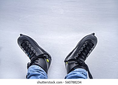 Legs Of Ice Skater With Start Sign On The Ice Rink, View From Above