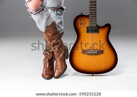 Legs in Jeans and Cowboys Boots