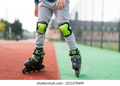 The Legs Of The Little Boy Roller Skating