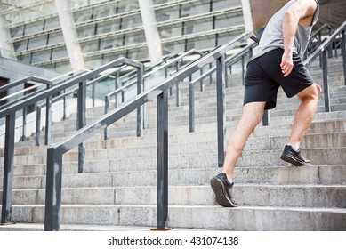 Legs Of Man Going Up On Stairs