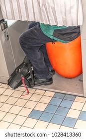 Legs Of A Man In A Passport Photo Room