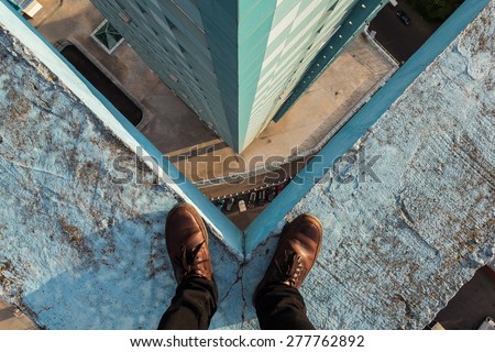 Legs of a man standing on the edge, Moscow