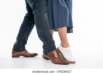 Legs of man and woman in stylish clothes isolated on white