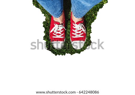 Similar – Person standing on a path with a green leaf nearby