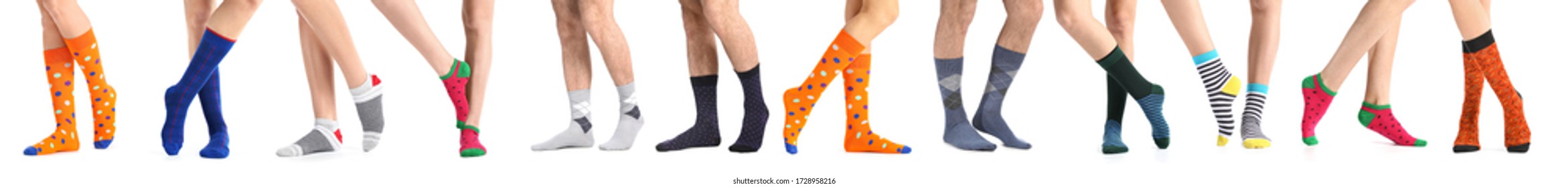Legs of people in different socks on white background