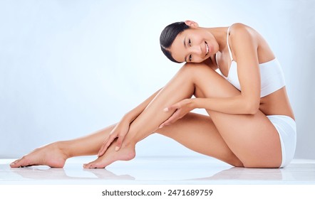 Legs, portrait and Asian woman in studio for hair removal, cleaning and skin care for body. Underwear, model girl and pride for dermatology, laser treatment and cosmetics by white background