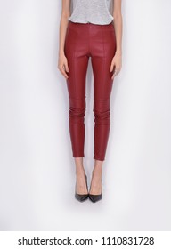 Legs In Red Leather Trousers With Black High Hell Shoes Posing


