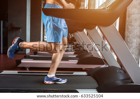 Legs running on the treadmill close up
