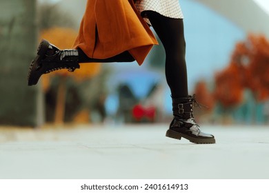 
Legs of a Running Woman Wearing Cold Season Boots 
Girl in a hurry jumping in patent leather autumn shoes 
 - Powered by Shutterstock